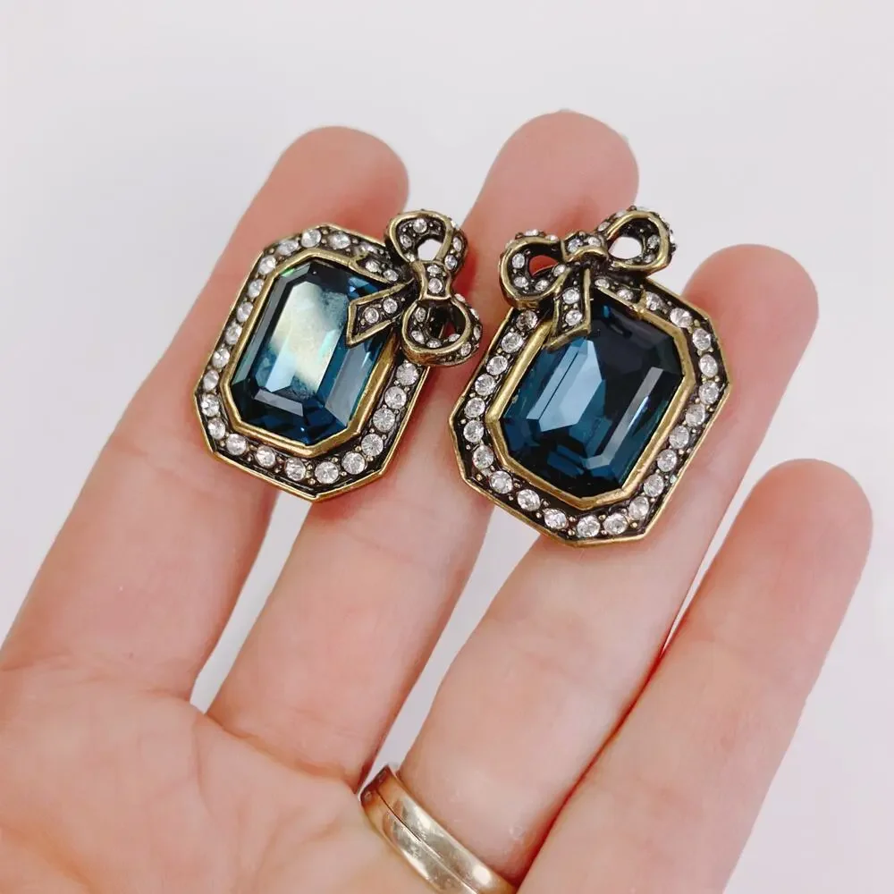 Vintage Signed Heidi Daus Blue Glass Bow Clip On Earrings Rhinestone Collectible